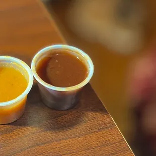 Orange spicy sauce and red sweet spicy sauce.