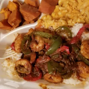Jerk shrimp, white rice, Mac n cheese and yams NEVER DISSAPOINT. And a Jamaican sunset dink