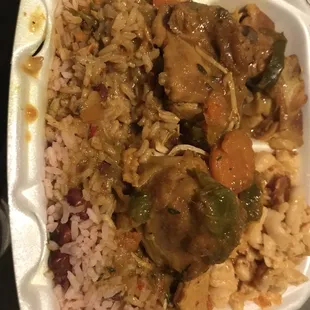 Curry chicken with rice and peas and mac