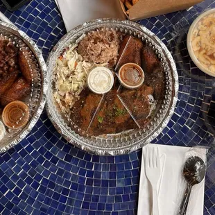 Jerk pork plate, jerk chicken plate, jerk macaroni, and greens.