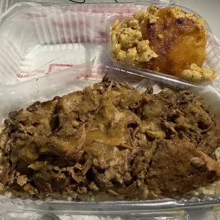Cuban Pork Roast Jerk Style on bed of rice and beans with macaroni and cheese