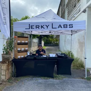 a man working under a tent