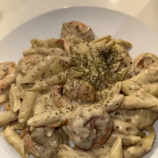 a plate of pasta and shrimp