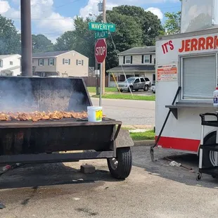 a bbq with smoke coming out of it