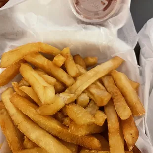 French fries, well done as requested, with ketchup