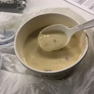 a bowl of soup with a spoon in it