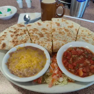 Huge breakfast quesadilla aka lazy fat burrito. I forced myself to eat at least two slices and took the rest home.