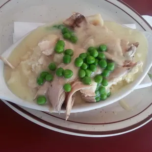 Chicken &amp; Dumplings. Juicy chicken, fluffy dumplings (biscuits), delicious gravy. What more could a girl ask for?! :)
