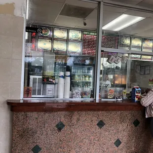 a woman standing in front of a counter