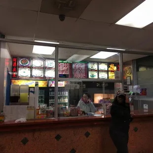 a woman standing in front of the counter