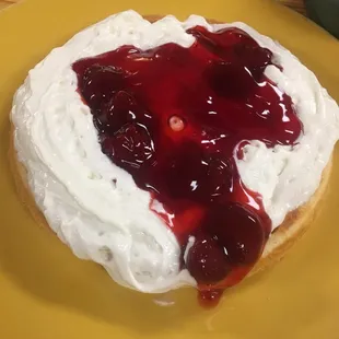 Waffle with strawberry toppings whip cream