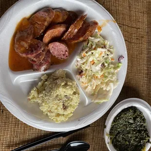 Smoked sausage in sauce with potato salad, Cole slaw, &amp; spinach