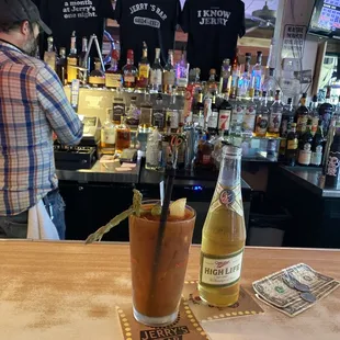 a bloody drink and a bottle of beer