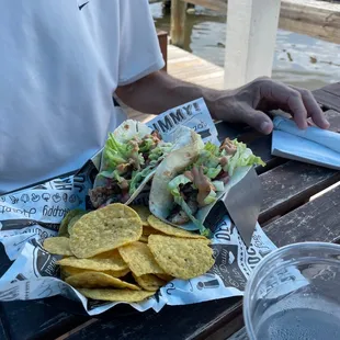 a plate of tacos and chips