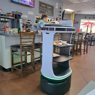 The robot serving to a table.