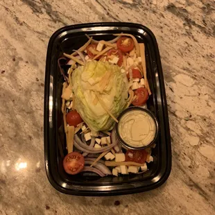 a salad in a plastic container