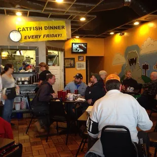a large group of people sitting at tables