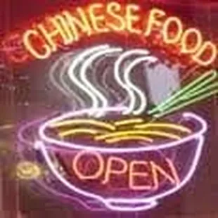 a neon sign for a chinese food restaurant