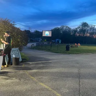 a man standing in a parking lot