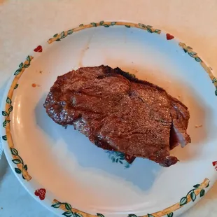 a piece of steak on a plate