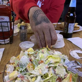 a man preparing a salad
