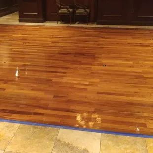 a hardwood floor being sanded