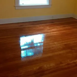a room with a hard wood floor