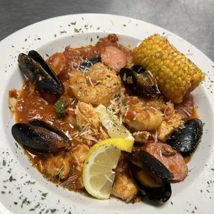 a plate of seafood and corn