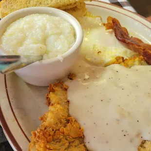 Chicken fried steak and grits.