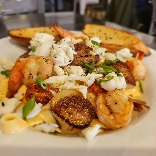 This was the seafood linguini that was amazing. It came with butterfly shrimp scallops and I added crab meat. It was really good.