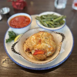 Crab cake and Lobster, stewed tomatoes and roasted green beans.