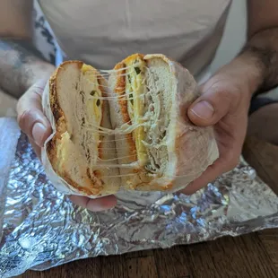 a man holding a sandwich