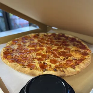 a pepperoni pizza in a pizza box