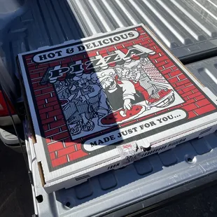 28" pizza box in the only place it would fit in the truck. The bed