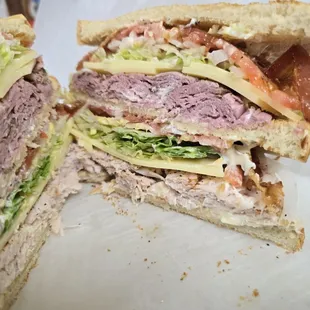 Our club is one of our best sellers, filled with Turkey, Roast Beef, Bacon, swiss cheese Lettuce and Tomato, Triple decker! BIG!