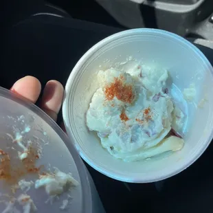 Potato salad, barely fills half the cup.