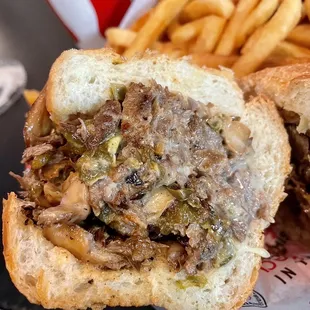 a beef sandwich and french fries