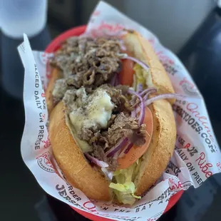 a sandwich with meat and onions