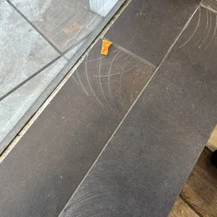 Chips and dirt on the window sill...