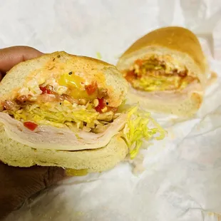 Turkey Provolone Mike&apos;s Way fully loaded with mayo, lettuce, tomatoes, banana peppers, onions, and red chili pepper sauce.