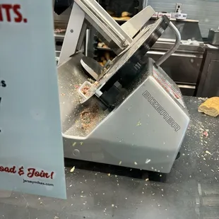 Slicer was loaded with grease and the meats and cheese was everywhere