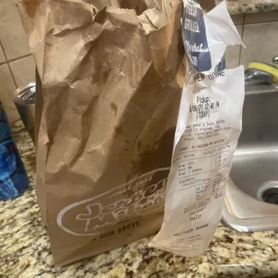 Unopened greasy bag from a Tuna Wrap and a Mini Club Sub 8/21/21