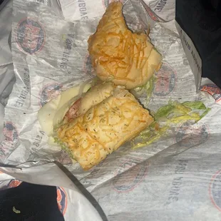 a sub sandwich in a wrapper