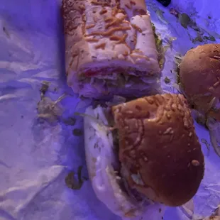 Mike's way sandwich: Rosemary bread with turkey, provolone cheese, mayo, mustard, pickles, lettuce, tomato.