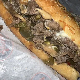 The #55 Big Kahuna Chicken Cheese Steak on rosemary Parmesan bread, size regular