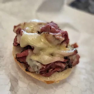 a sandwich with meat and cheese