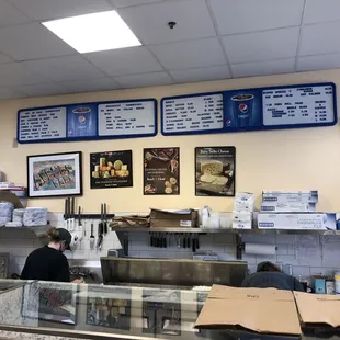 a man sitting at a counter in a restaurant