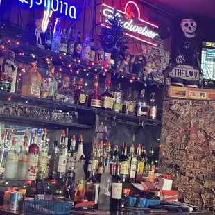 a bar with neon signs