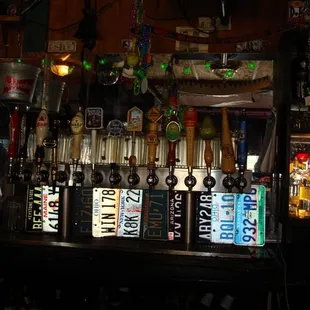 a row of beer taps