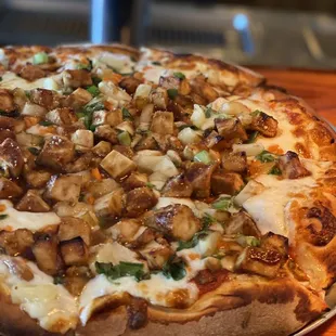 a pizza on a plate on a table